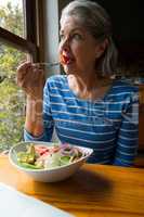 Senior woman having a salad