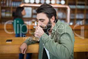 Man drinking glass of beer
