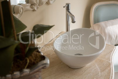 Close-up of faucet and sink in bathroom