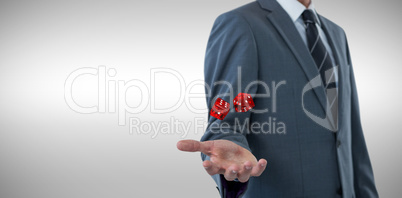Composite image of midsection of sophisticated businessman offering