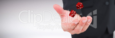 Composite image of businessman holding out his hand