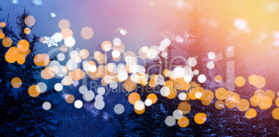 Trees and mountains with bokeh in foreground