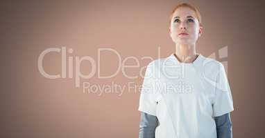 Woman looking up with brown background