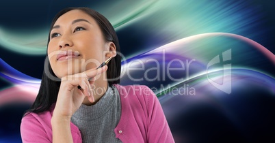 Woman looking up casually with colorful curves background