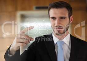 Businessman touching air in front of elevator