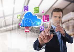 Cloud app interface and Businessman touching air in front of warehouse