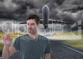 Businessman touching air in front of airplane on runway