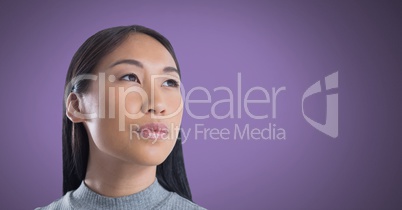 Woman looking up with purple background