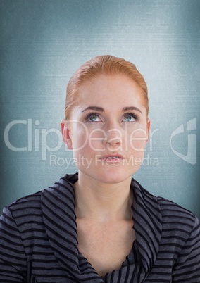 Woman looking up with blue background