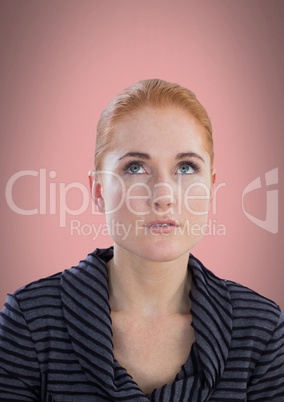 Woman looking up with pink background