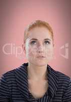 Woman looking up with pink background