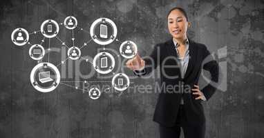 Technology interface and Businesswoman touching air in front of grey wall