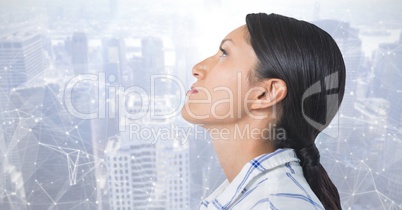 Woman looking up with interconnected city background