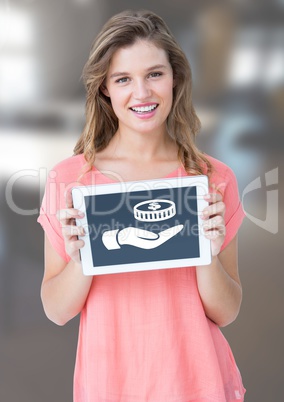 Woman holding tablet with hand giving money icons