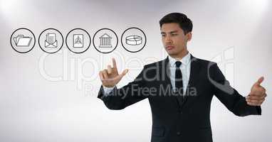 Business icons and Businessman touching air with hand gestures in front of white background