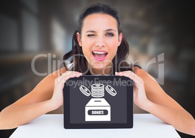 Woman holding tablet with donate for charity box and money icon