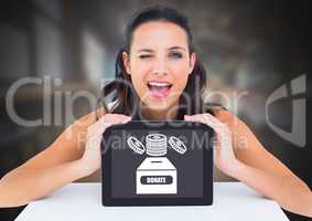 Woman holding tablet with donate for charity box and money icon