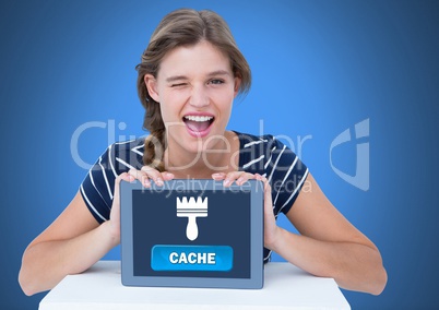 Woman holding tablet with Cache button and clean brush icon