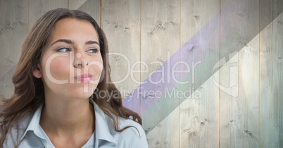 Woman looking suspiciously with wooden background