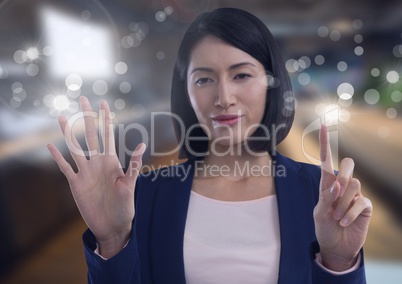 Businesswoman touching air in front of office