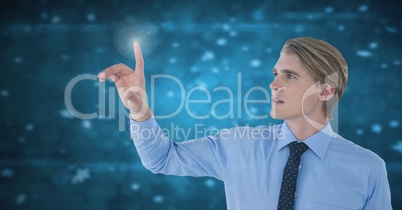 Businessman touching air in front of blue light particles