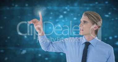 Businessman touching air in front of blue light particles