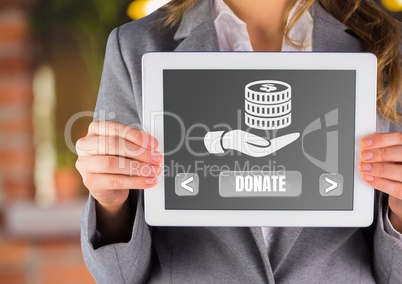 Hand holding tablet with donate button and hand holding money icon for charity