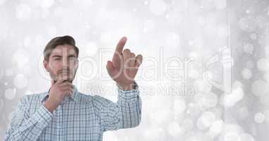 Businessman touching air in front of sparkles
