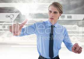 Technology interface and Businessman touching air in front of clouds