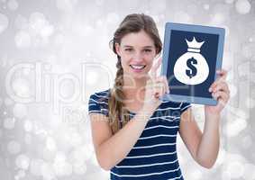 Woman holding tablet with money bag icon