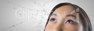 Woman looking up with connected scientific patterns background
