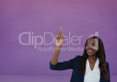 Businesswoman touching air in front of purple background