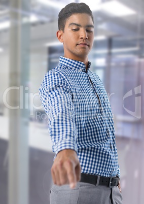 Businessman touching air in front of office