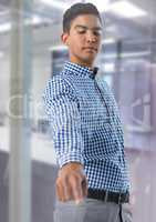 Businessman touching air in front of office