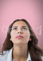 Woman looking up with pink background
