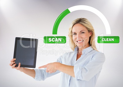 Woman holding tablet with scan clean buttons and status bar