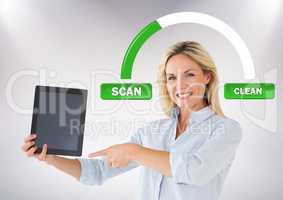 Woman holding tablet with scan clean buttons and status bar