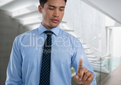 Businessman touching air in front of stairway
