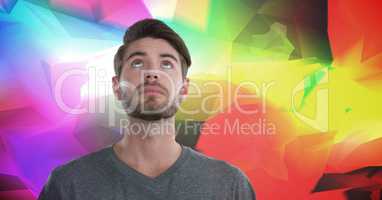 Man looking up with colorful polygons background