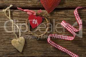 Overhead view of heart shape decoration with ribbon and wreath