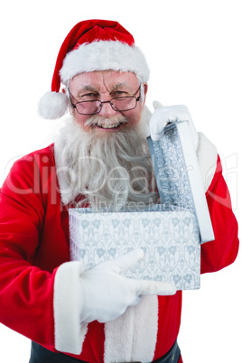 Santa Claus opening a gift box