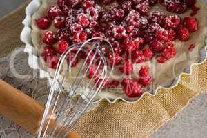 Red berries on tart with whisker