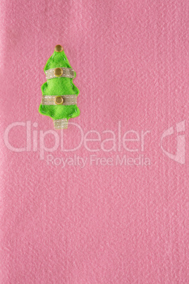 Decorated christmas tree on pink background
