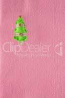 Decorated christmas tree on pink background