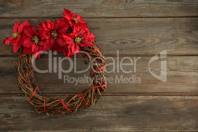 Christmas wreath on wooden plank