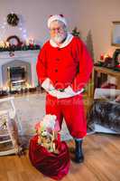 Santa claus standing with his hands on waist