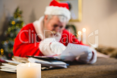 Santa Claus reading a letter