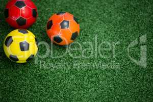 Footballs on artificial grass