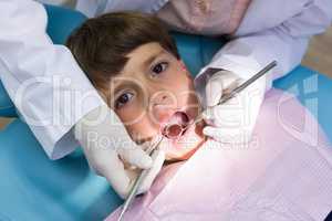 Boy receiving dental treatment at clinic
