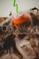 Drink in jack o lantern container with decorations